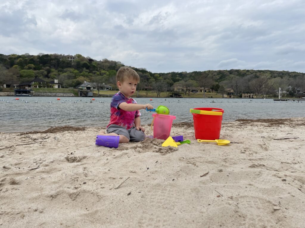 emma long park beach in austin playing in the sand