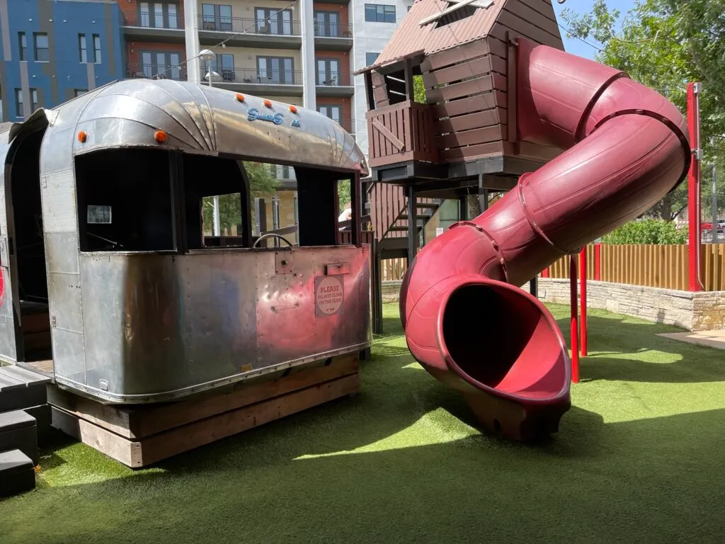 Hat Creek's playground consisting of a funky converted airstream and a lookout cabin with a slide