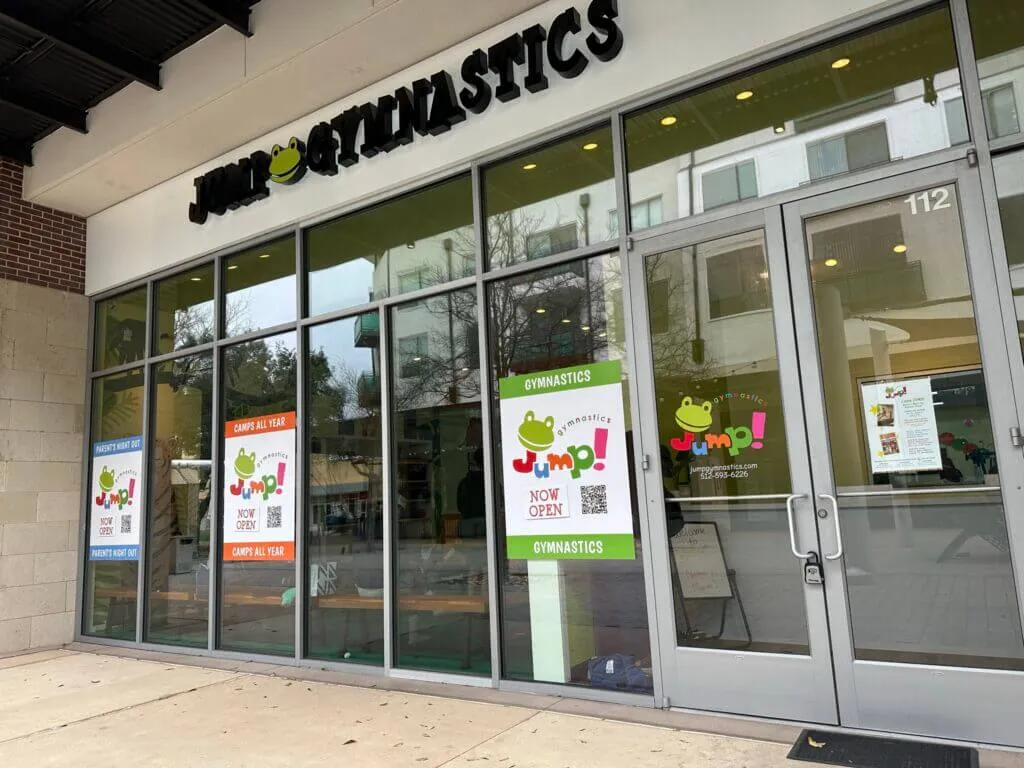 Storefront of Jumpy Gymnastics with cute frog signs