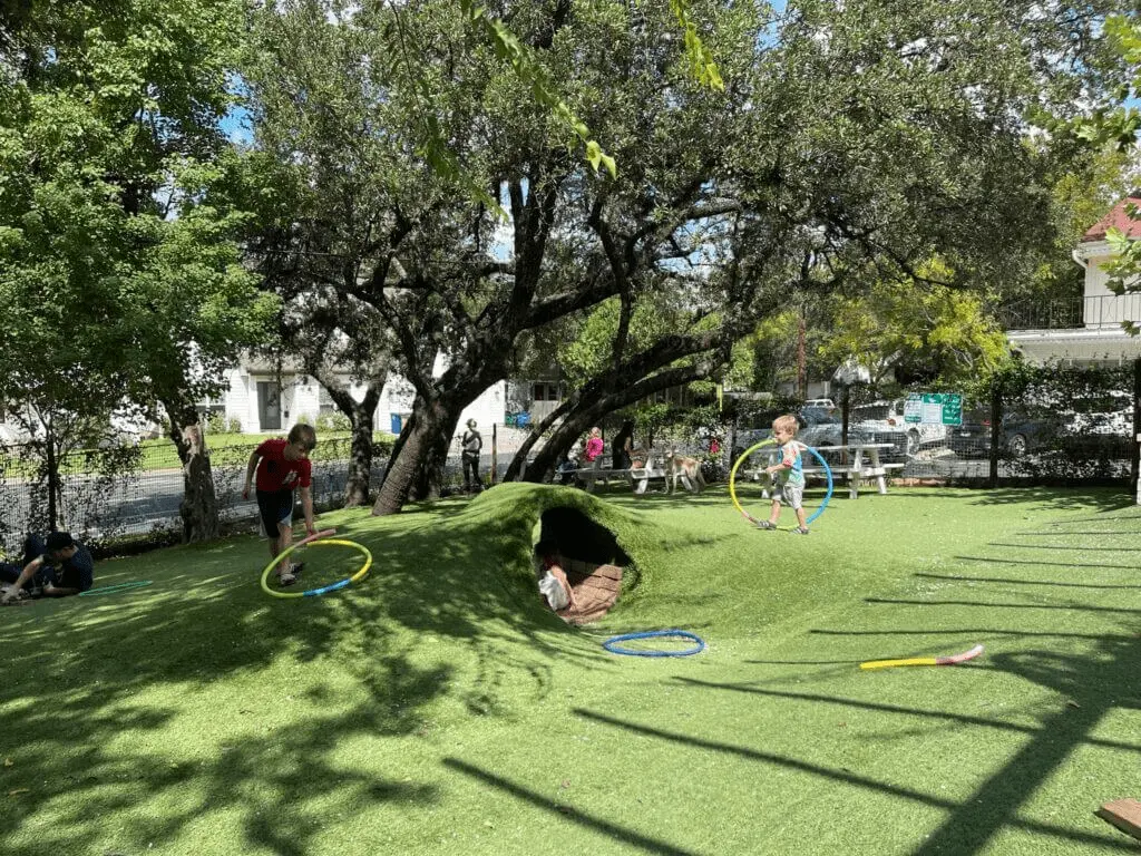 Littlefield's restaurant with outdoor turf area with tunnels and toys