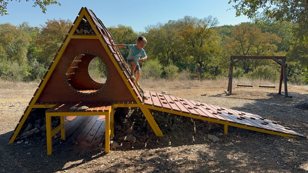 leaning pear restaurant with playground in wimberley