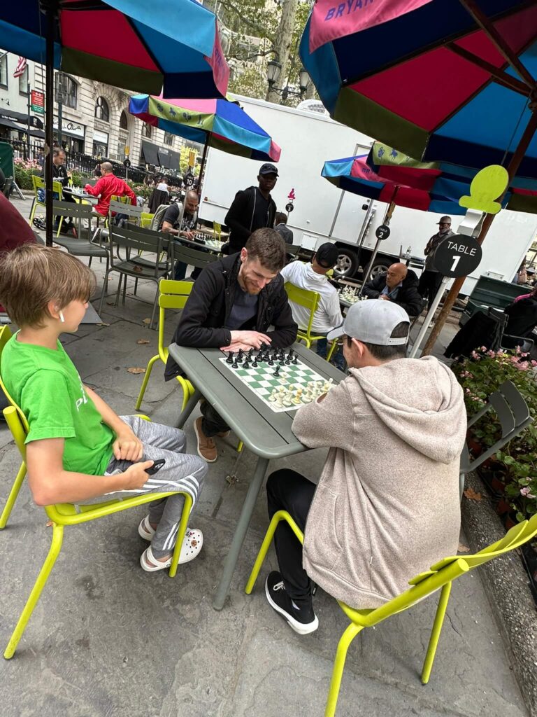 playing chess at bryant park in new york