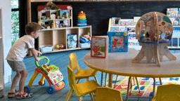 Indoor play area with toys and kids table inside a family-friendly Austin restaurant