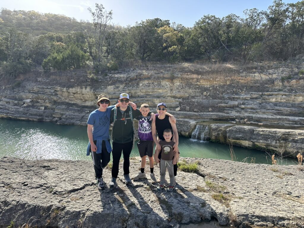 Family hiking on a Canyon Lake Gorge tour